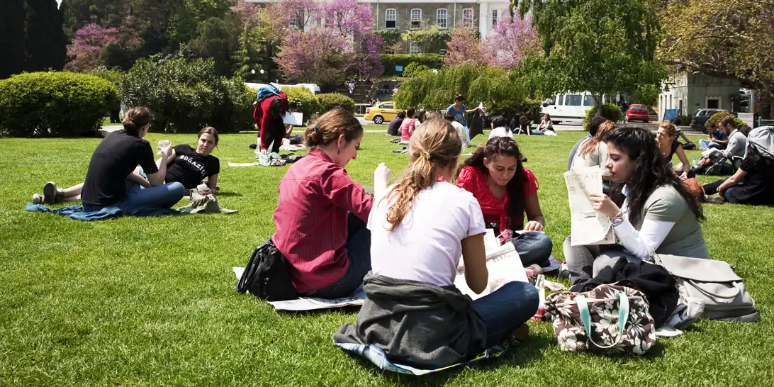 University life students chilling in campus garden